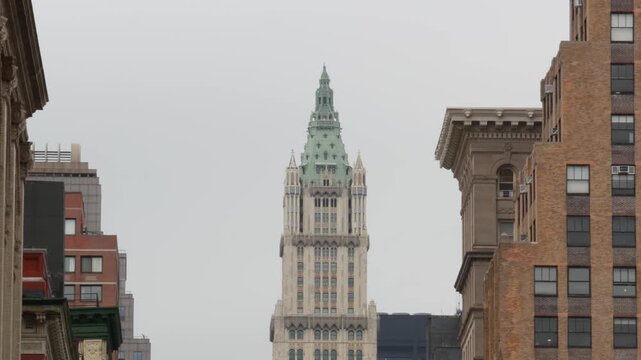 New York City Woolworth building 1913, skyscraper on Broadway in Downtown Financial District, Lower Manhattan, United States of America. Gothic historic architecture, green cooper roof from Soho, USA.