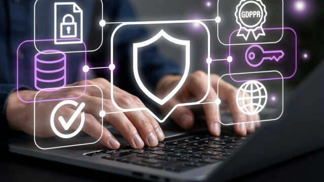 Data protection and cybersecurity concept. Hands typing on laptop keyboard with shield, GDPR compliance, encryption key, and security icons overlay.