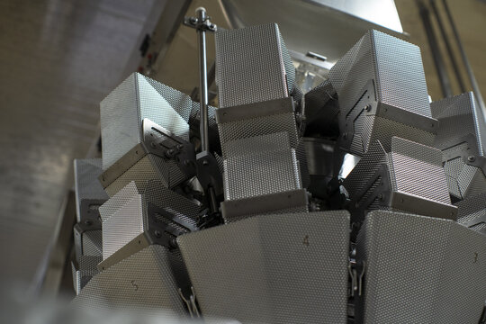 View of a multi-head weigher machine used for packaging in an avocado processing plant in Uruapan, Michoacan, Mexico.