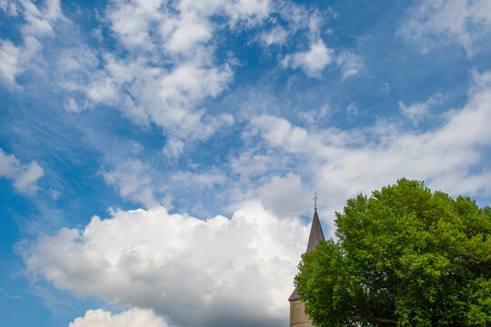 Clouds in a blue sky in bright sunlight in summer, Voeren, Limburg, Belgium, August, 2026