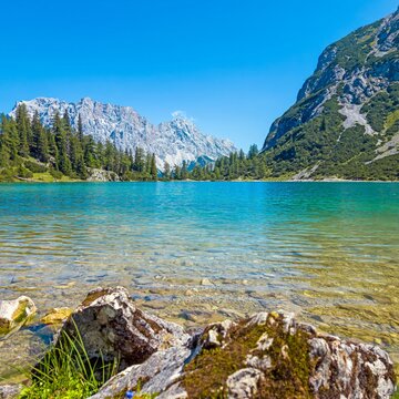 Turquoise Seebensee beneath rugged mountains in Tyrol Austria