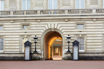 Buckingham Palace archway entrance with royal sentry boxes in London