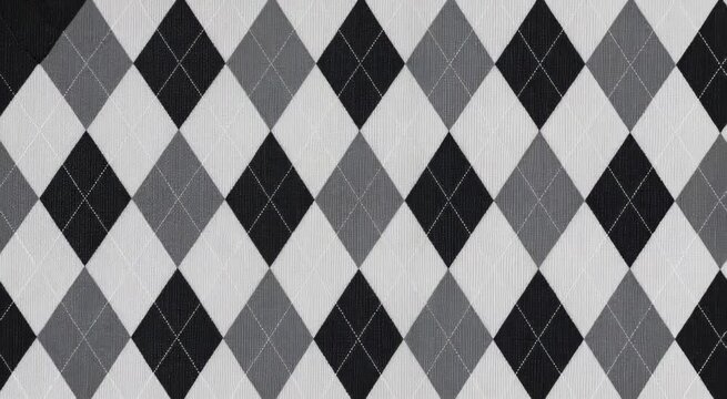 Monochrome argyle diamond textile pattern in black, gray and white with stitched detailing