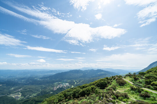 Panoramic aerial view of Beppu city and Beppu bay under blue sky with clouds from mountain viewpoint in Oita Japan