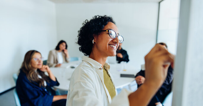 Woman presenter leads with ideas in team meeting