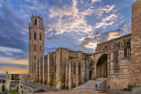 South facade and bell tower of Old Cathedral of Lleida, Spain. Sunset sky, medieval Romanesque and Gothic style