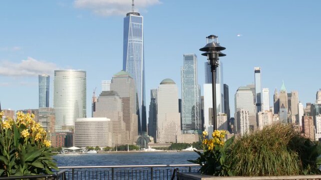 New York City Manhattan downtown financial district skyline, New Jersey Exchange Place, United States. Urban cityscape with skyscraper buildings, World Trade Center. J Owen Grundy park, Paulus Hook.