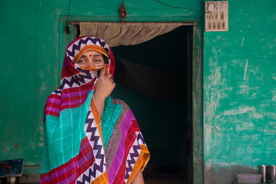 Indian woman holding a veil on her head