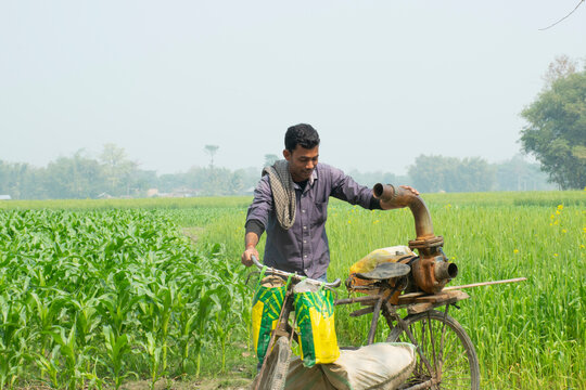 Indian farmer with water pump