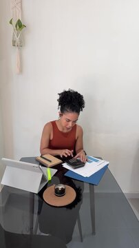 Focused accountant woman managing budget and finances