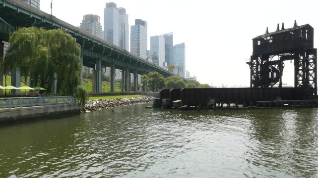 New York City Riverside Park South Manhattan United States. Modern residential building Upper West Side. Urban skyscraper skyline. Miller highway remnant, elevated viaduct. Industrial gantry dock pier