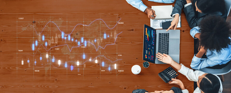 Collaborative Business Meeting with Stock Market Data Analysis on Laptop at Wooden Table with Professionals Discussing Strategy and Business Trends. Entropy.