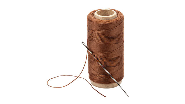 Spool of brown sewing thread with metal needle hardware isolated on white background
