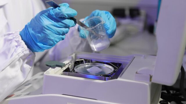 Scientist weighing white powder on analytical balance. Professional chemist in a laboratory weighing a white powder substance on a digital analytical scale. Precision and accuracy in research.