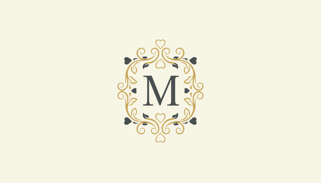 Elegant luxury monogram logo featuring the letter M enclosed within an ornate gold and black flourish frame design.