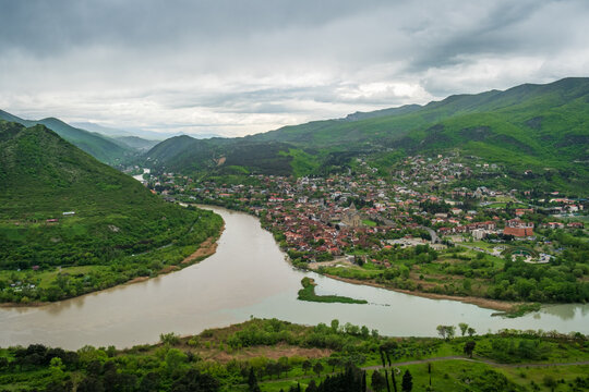 View of the confluence of the Aragvi and Mtkvari rivers with the historic Svetitskhoveli Cathedral in the town of Mtskheta, Mtskheta-Mtianeti, Georgia.