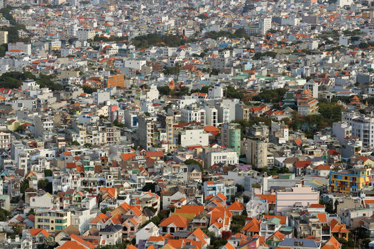 High angle view abstract background texture of crowded city buildings and orange rooftops in Vung Tau.