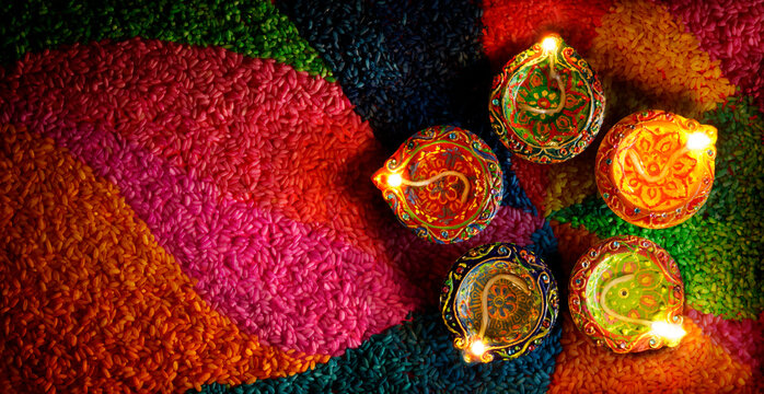 Diwali Diya Lamps With Colorful Rangoli - Indian Hindu Festival of Lights