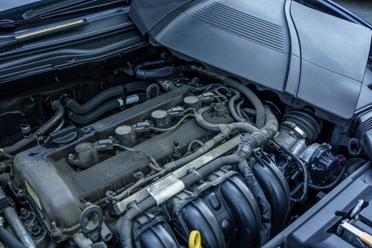 Modern car engine bay close up under the hood during inspection. Pre-purchase vehicle inspection, used car diagnostic