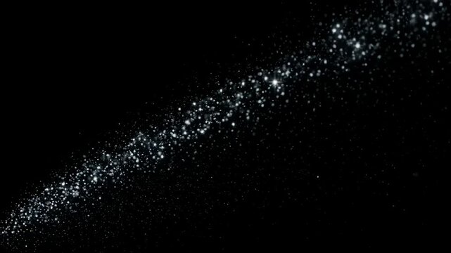 Shimmering light streaks with glittering particles move across a dark background during a cinematic motion sequence