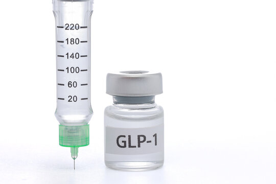 Medical glp1 injection pen beside glass bottle container brings hopeful feeling for patient seeking modern diabetes treatment plan