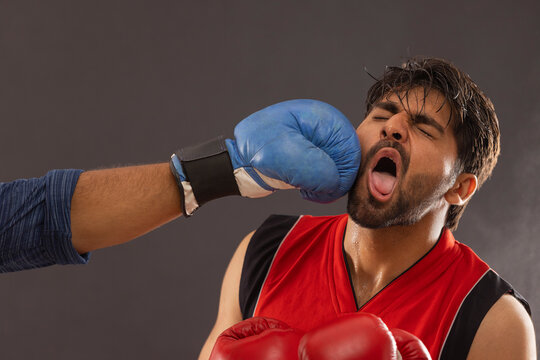 A BOXER PUNCHED BY ANOTHER PLAYER WHILE BOXING