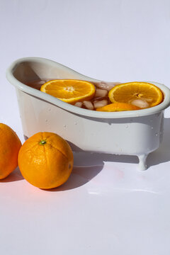 Aperol Spritz in a Miniature Bathtub with Orange Slices and Ice