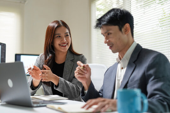 Business Colleagues Discussing Ideas in Office Meeting