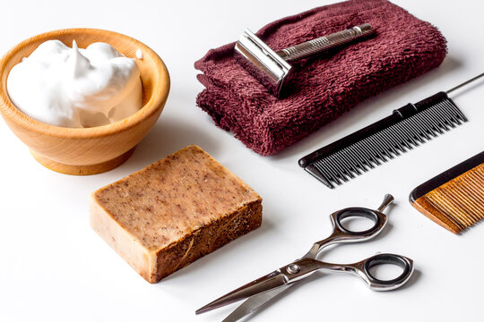 white desktop with tools for shaving beards