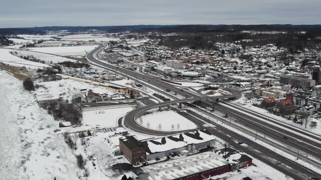 Aerial view of snowy roads and residential area in Alvangen by the Gota alv river