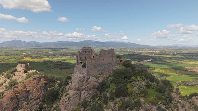Stone Ruins Of The Castle of Acquafredda, 13th-century Medieval Fortress In Siliqua, South Sardinia, Italy. Aerial Drone Shot