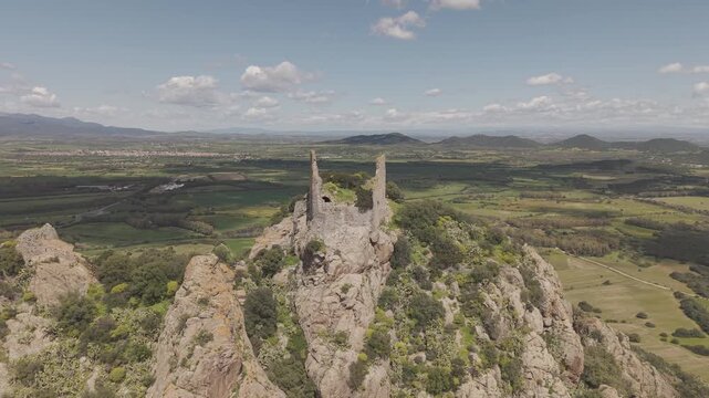 Hilltop Ruins Of Castello di Acquafredda, Medieval Castle Near Siliqua In Southern Sardinia, Italy. Aerial Shot