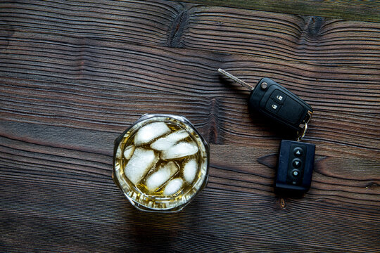 concept of alcohol and driving on wooden background top view