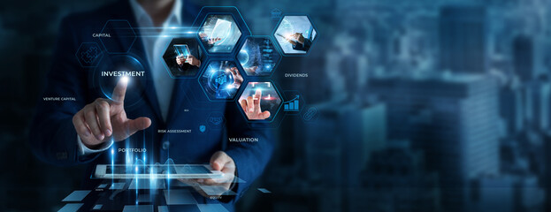 Fototapeta premium Businessman Using Tablet for Analyzing Investment Data. Monitoring financial markets, evaluating business opportunities, improving portfolio strategies, investment decisions.