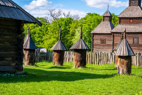 Traditional wooden beehives in an open air museum of Ukrainian folk architecture