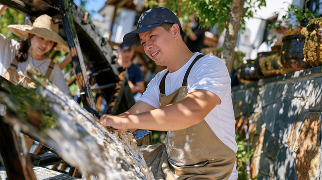 Watermill operator family in busy riverside district, stone-ground flour dusting their aprons as koji spore cultures ferment in ceramic crocks along the wall, generational mill operation, fermented 