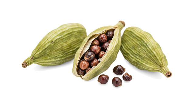 Fresh green cardamom pods with dark brown seeds isolated on white background, macro studio shot highlighting natural textures and warm herbal culinary essence.