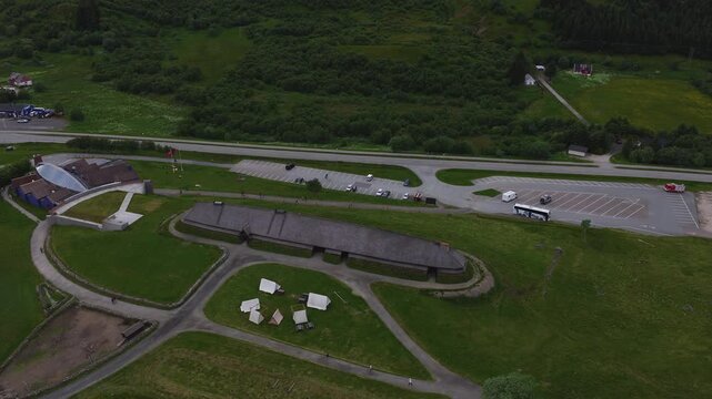 An aerial view captures the reconstructed chieftain longhouse, visitor centre, and surrounding grounds at Lofotr Viking Museum in Borg, Lofoten, Norway.