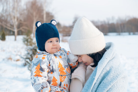 Smiling Mother and Baby Enjoying a Winter Day