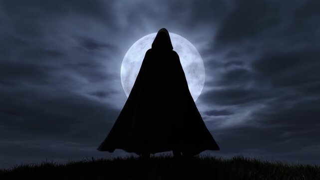 Dramatic Silhouette of Hooded Cloaked Figure Standing on Hill Against Huge Bright Full Moon at Night