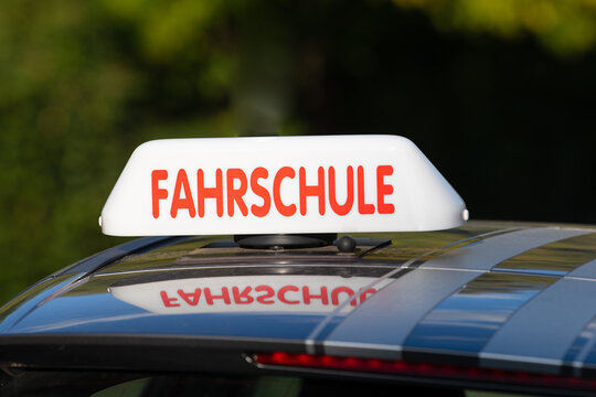 Driving school roof sign in german language, legal required to alert road users that a student driver is behind the wheel, car driver license concept