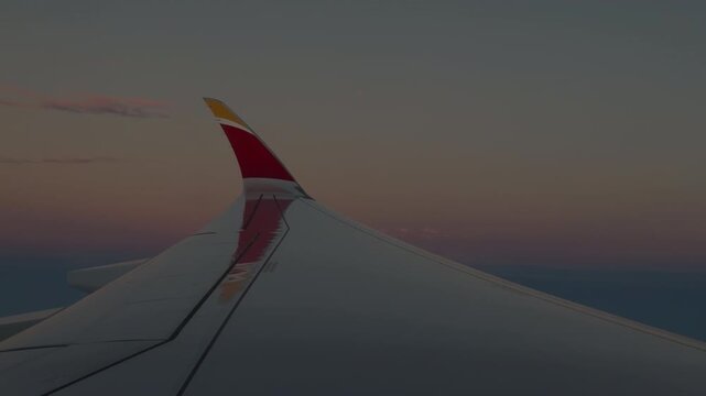 Airplane Wing Above a Soft Layer of Clouds