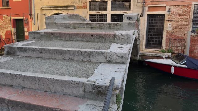 Slow Approach to Stone Bridge Over Venetian Canal