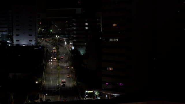 Aerial Night View of Busy Urban Avenue and City Lights