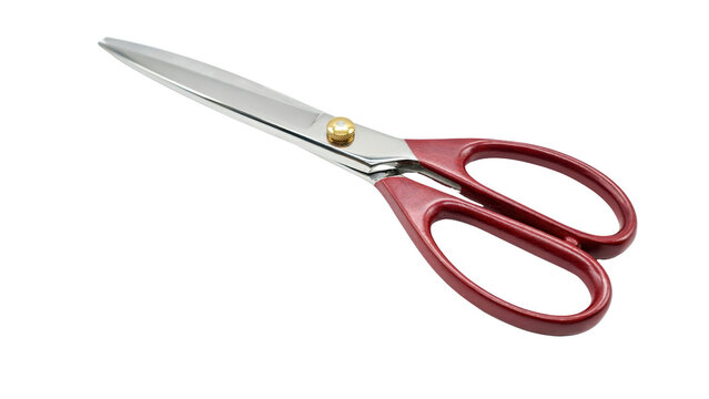 Sharp stainless steel tailoring scissors with red plastic handles and a brass pivot screw isolated in a high angle view placed on transparent background