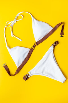 Women&rsquo;s bikini minimal composition, top view &mdash; summer holiday mood, modern flat lay, neutral tones
