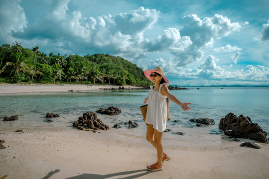 View of sea beach with woman tourist in Koh Thalu island in Prachuap Khiri Khan is a location, summer traveling for vacation