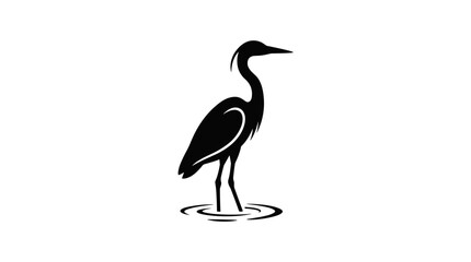 Naklejka premium Silhouette of a Great Blue Heron standing in shallow water.