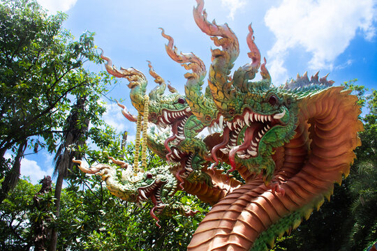 Ancient naga or antique naka statue for thai people travel visit respect praying blessing wish and myth mystery mystical holy deity angel at Ganesha Devasathan or Ganesh Park in Nakhon Sawan, Thailand