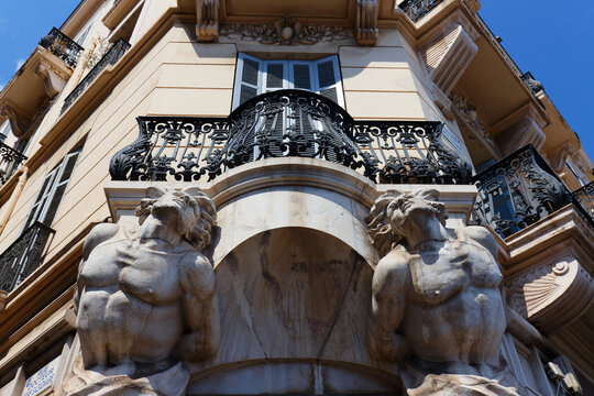 Haussmann-style corner facade with atlantes, Cannes.